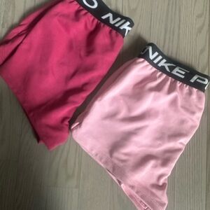 Nike Red and Pink Athletic Shorts . Kids sz L. NWT